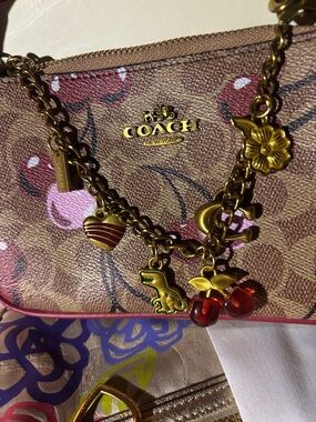 COACH Pink Cherry Charm Chain small bag with strap with Signature Canvas